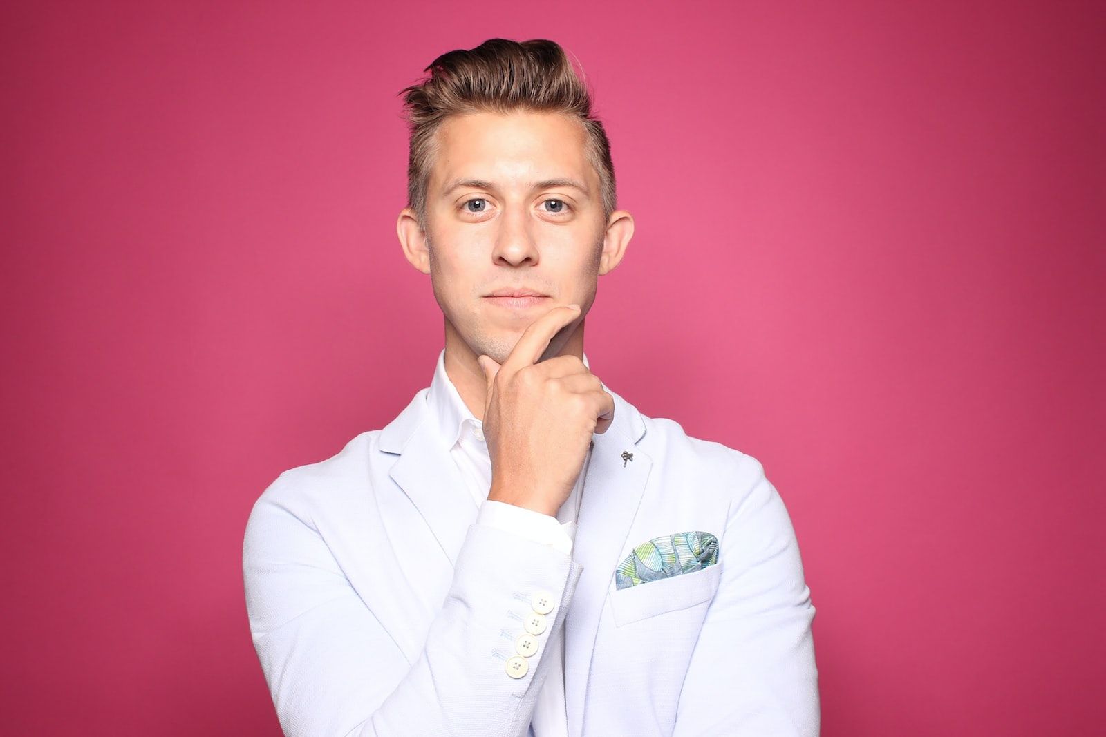 Photo by Austin Distel man in white suit jacket
